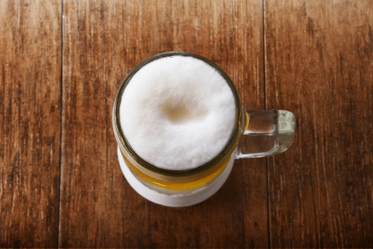 Glass of Beer on the Wooden Table