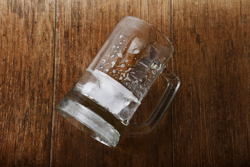 Empty Glass of Beer on the Wooden Table