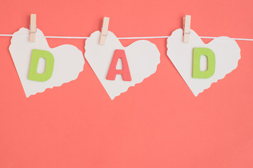 Dad message hanging from pegs on a line