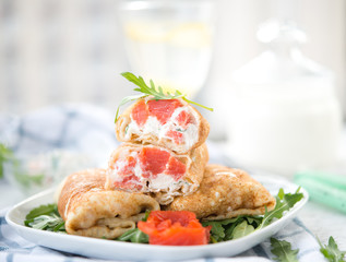 Nourishing pancakes with red fish and cream cheese
