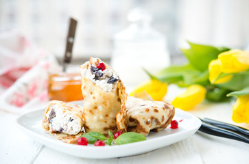 Homemade nourishing pancakes with cottage cheese and raisin
