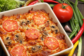 Casserole with tomato and mushrooms