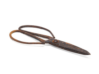 Old rusty scissors on white background