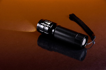 LED flashlight in backgroun