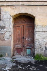 Fototapeta na wymiar Old brown painted wooden door 