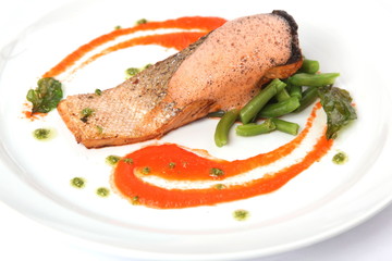 salmon steak on plate with sauce