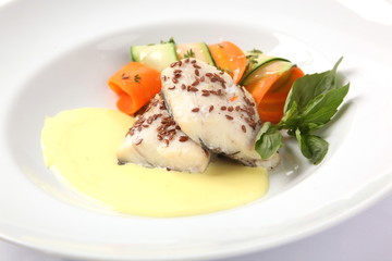 White fish on a plate with sauce