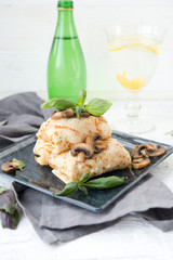 Nourishing pancakes with a stuffing, mushrooms and chicken
