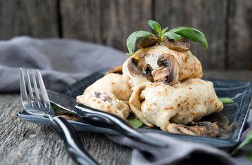 Nourishing pancakes with a stuffing, mushrooms and chicken
 - obrazy, fototapety, plakaty