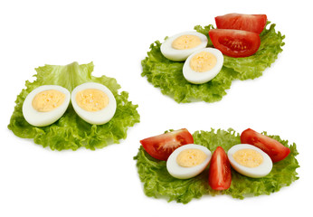 set half eggs and slices of tomato isolate on a white