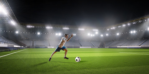 Soccer player hitting ball