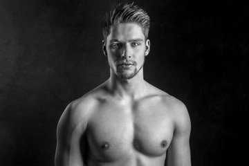 Handsome young and attractive man, male model. Shirtless male model. Black and white.