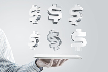 Tablet in hand with symbols