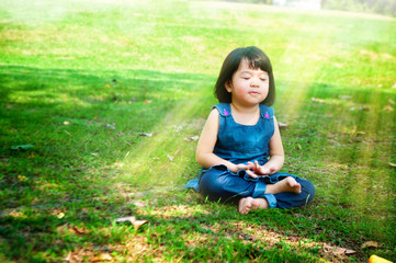 Meditating girl with light