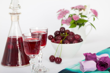 Celebration of Valentine day with cherry brandy and flowers