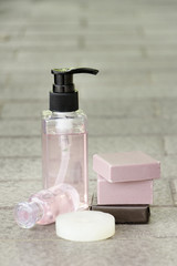 Shampoo and soap bars on light background. Personal care product spa concept