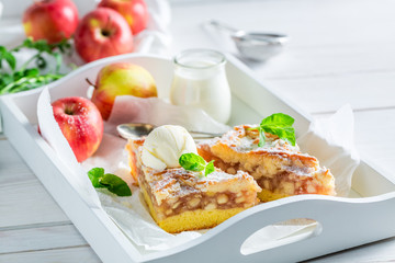 Sweet apple pie and ice cream with mint leaves