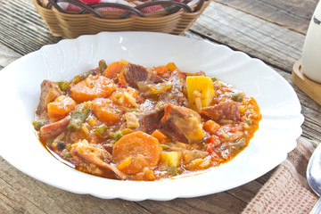 Pork meat stew with vegetables in plate
