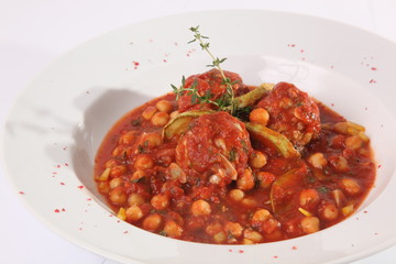 Zucchini in a red sauce with nuts, chickpeas