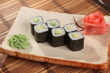Japanese roll with wasabi sauce on plate