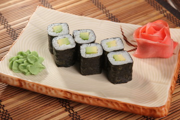 Japanese roll with wasabi sauce on plate