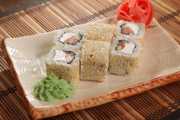 Japanese roll with wasabi sauce on plate
