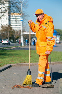 Man Road Yardman Worker Cleaning City Street With Broom Tool And Dustpan