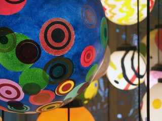 Random colorful ceiling lamps with selective focus
