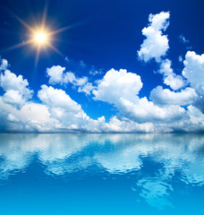 Fototapeta na wymiar sunny blue sky at coast of the sea, background