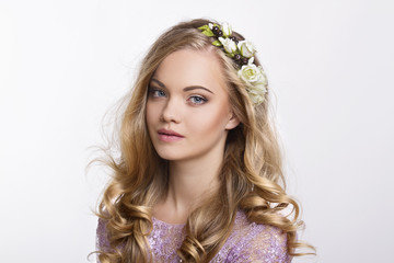 Naklejka premium Beautiful woman portrait with flowers on head and perfect makeup. Beauty fashion.
