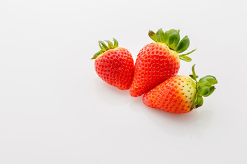 Closeup of not fully ripe strawberries