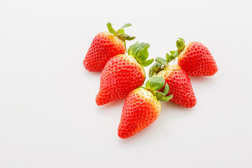 Closeup of not fully ripe strawberries