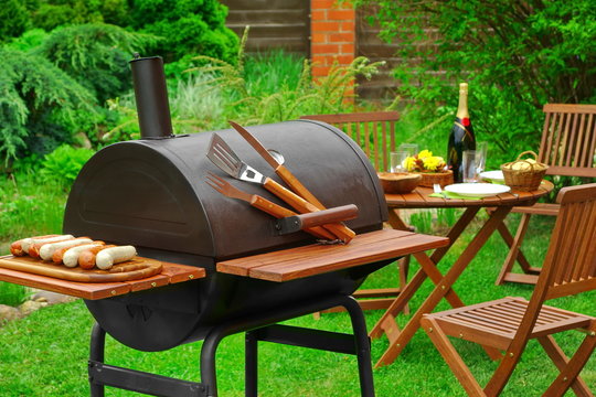 Summer Weekend BBQ Scene With Charcoal Grill On The Backyard