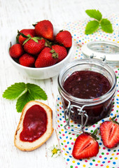 Strawberry jam and fresh strawberries