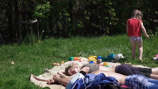 Girl with parents on picnic