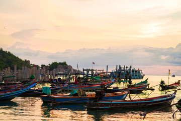 Fototapeta na wymiar Fishing and transport boat on Koh Tao beach warm light sunset ti