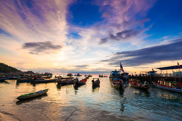 Fishing and transport boat on Koh Tao beach warm light sunset ti