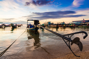 Fishing and transport boat on Koh Tao beach warm light sunset ti