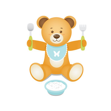 Bear with  fork and spoon in hands and with a plate of porridge.