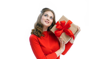 Fototapeta premium Joyful woman holding a box with gift