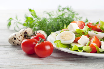 Fresh salad with quail eggs