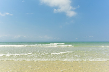 Fototapeta na wymiar Exotic beach with gentle wave and clear, Ripple wave and clear on beac with blue sky