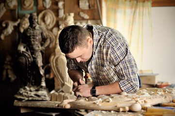 carver working in his workshop