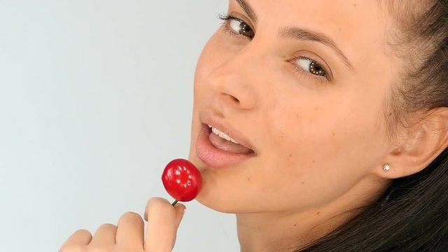 Sexy girl eating cherries, slow motion
