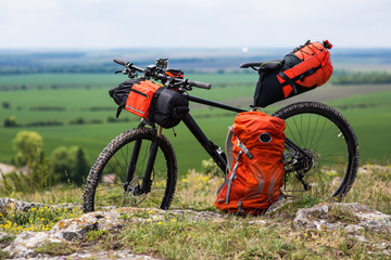 Bicycle with orange bags for travel