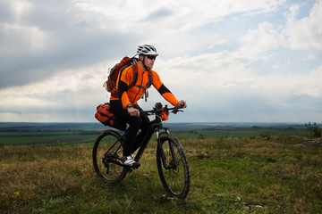 Naklejka premium Young man is riding bicycle outside. Healthy Lifestyle.