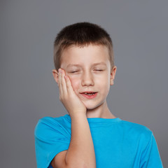 Little boy with painful toothache portrait