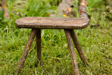 Wooden stool hand made on grass