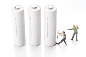 miniature people  - workers moving and recycle batteries, 
isolated on white
