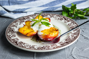Grilled nectarines with ice cream and balsamic cream